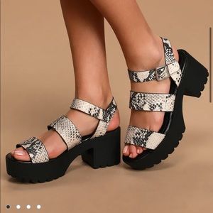 Brand new Black and snakeskin platform sandals